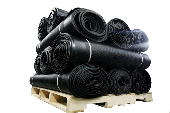Rolled up rubber pieces for tires on a pallet